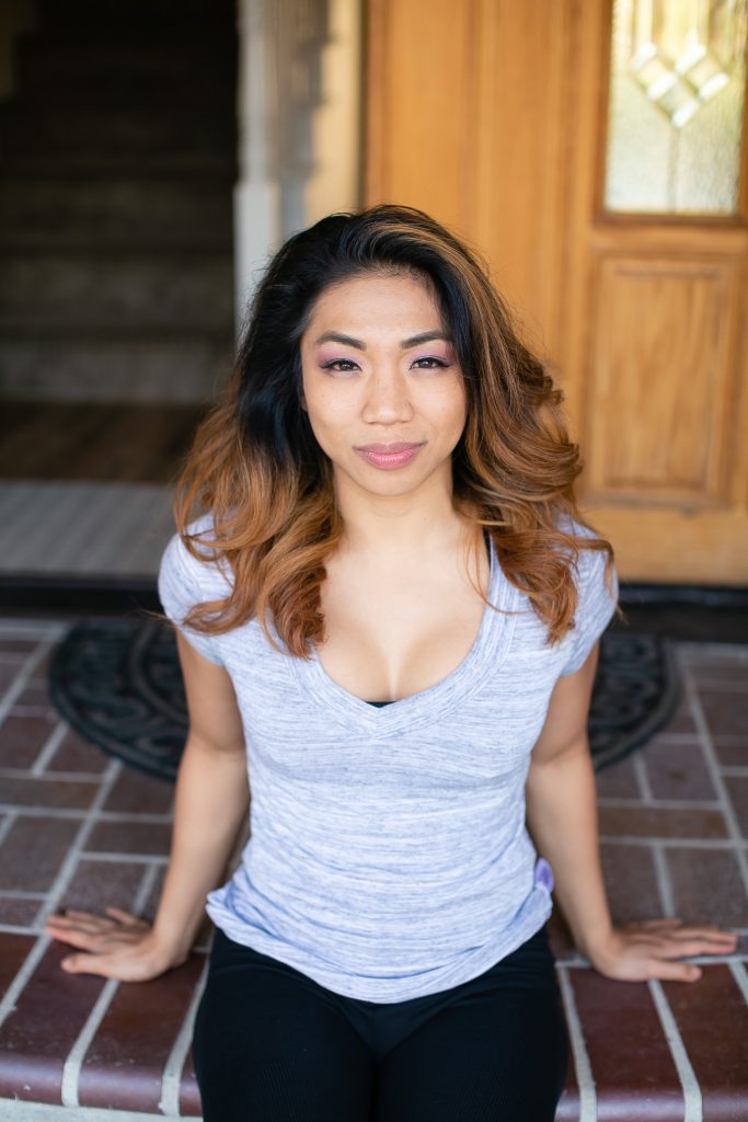 Woman in a gray shirt wearing a push up bra underneath