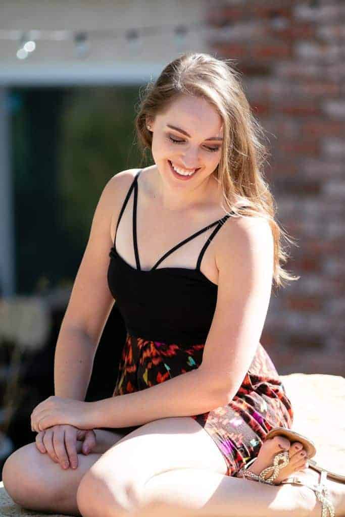 black strappy bralette colorful skirt