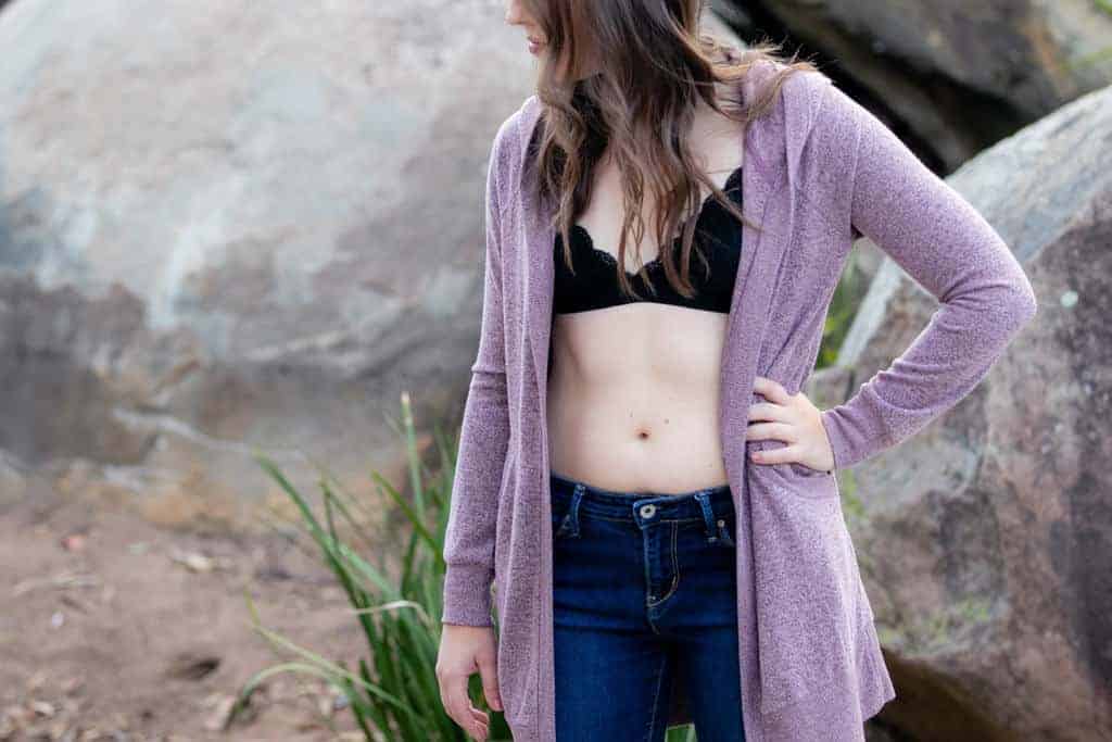 Purple cardigan black bralette jeans
