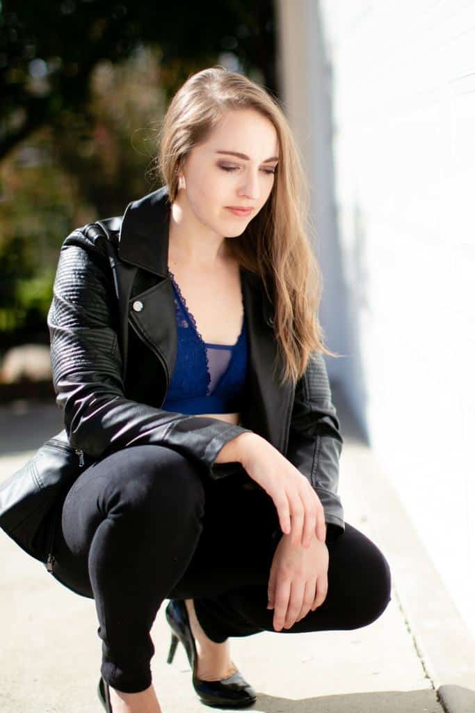 Mesh and lace bralette under leather jacket and pants