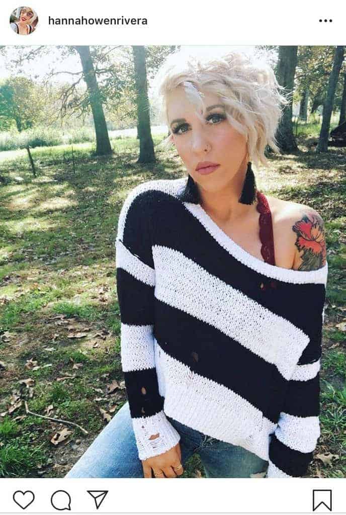 Black and white sweater with red bralette underneath