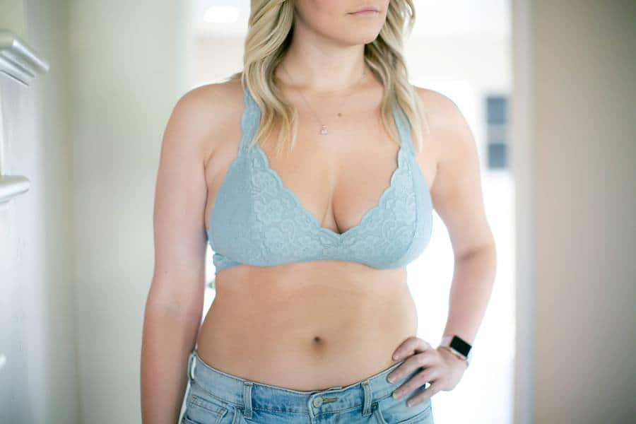Woman with a D cup size wearing a blue bralette
