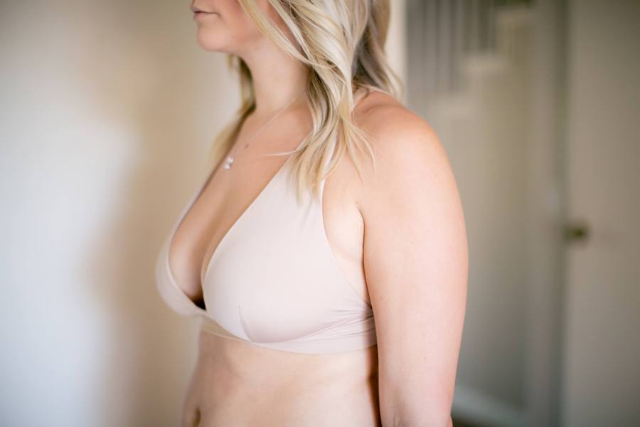 Woman wearing a nude colored bralette