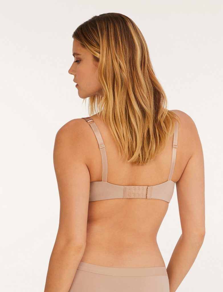 Woman wearing a flesh colored bra