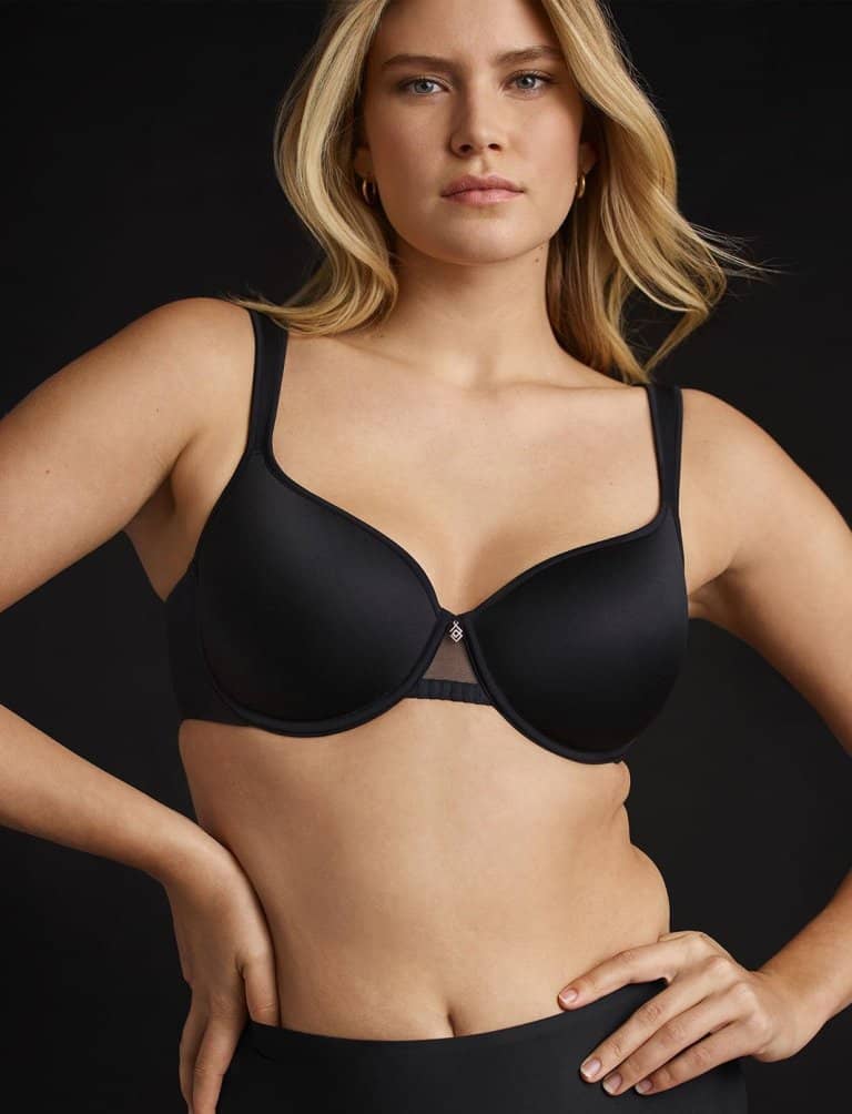 Woman wearing a matching black bra and underwear from Third Love