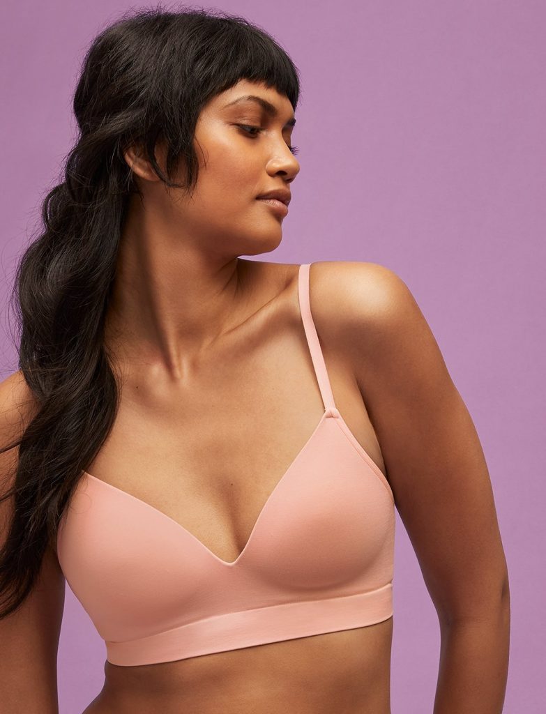 Woman wearing a Form Seamless V-Neck Wireless Bra from Third Love