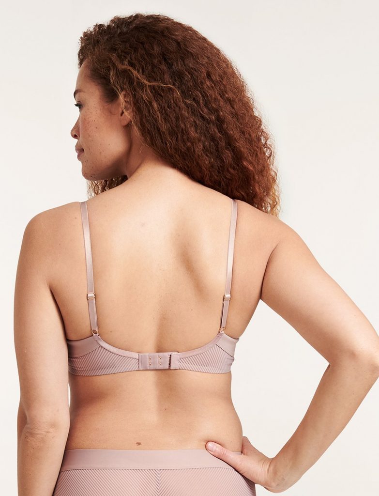 Woman showing the back of her bra