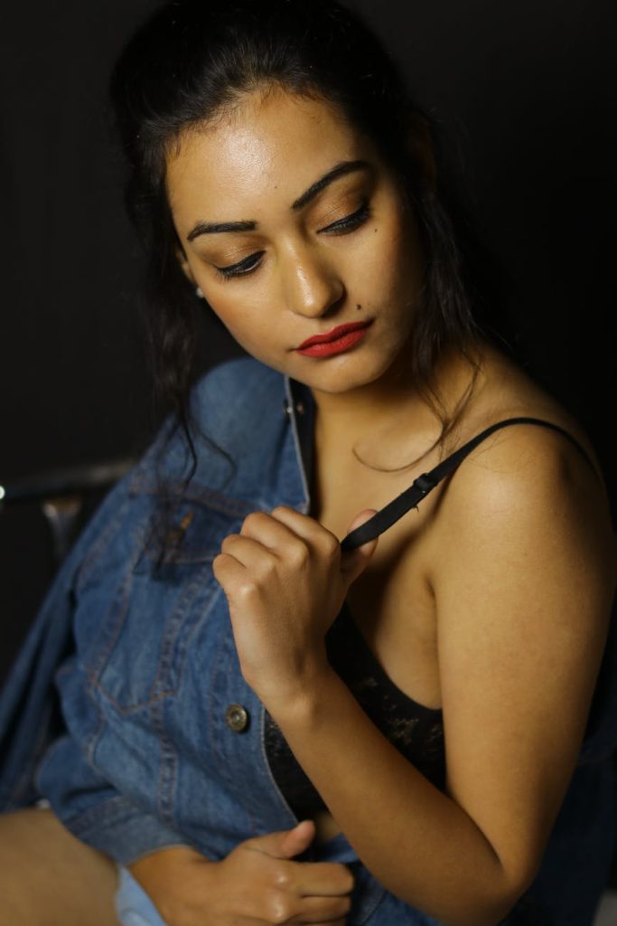 Woman holding her bra strap