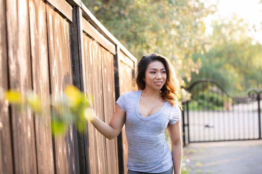 Woman wearing a gray V neck top