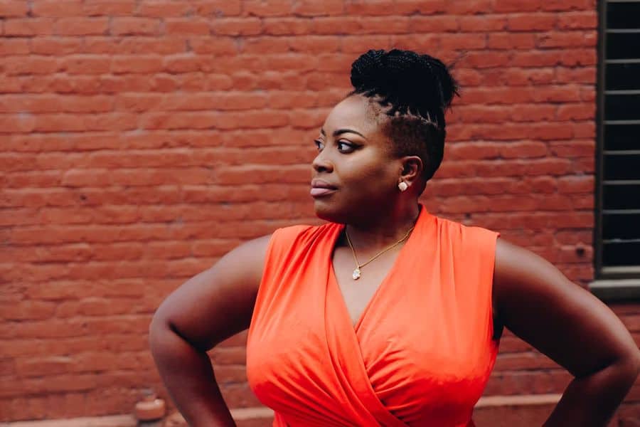 Woman wearing an orange wrap dress