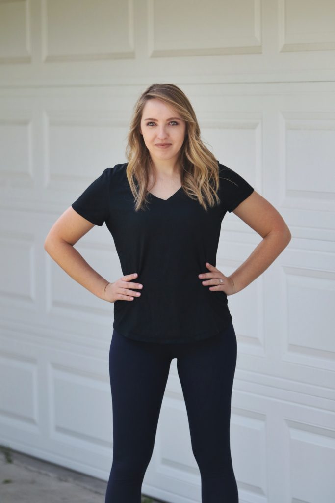Woman wearing a V neck top and leggings