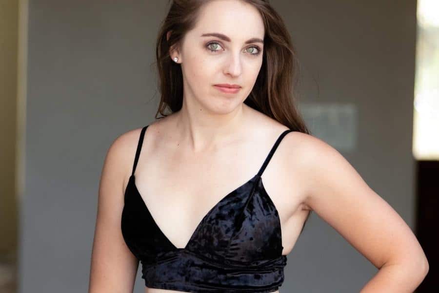An image of a woman wearing what a black velvet bralette looks like