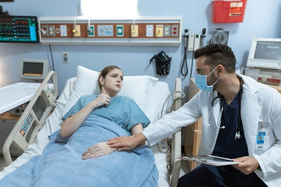 An image of a patient wearing hospital gown