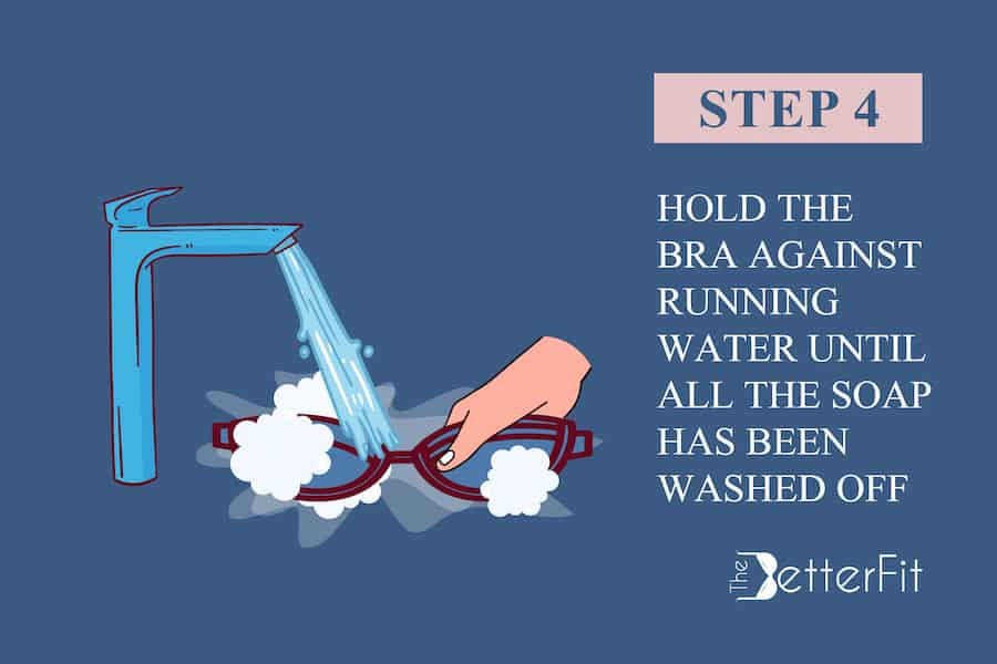 Fourth step is to hold the bra against running water until the soap has been washed off