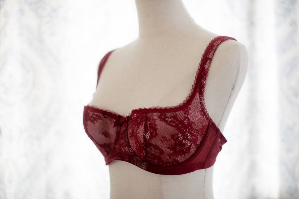 A red laced bra in a mannequin