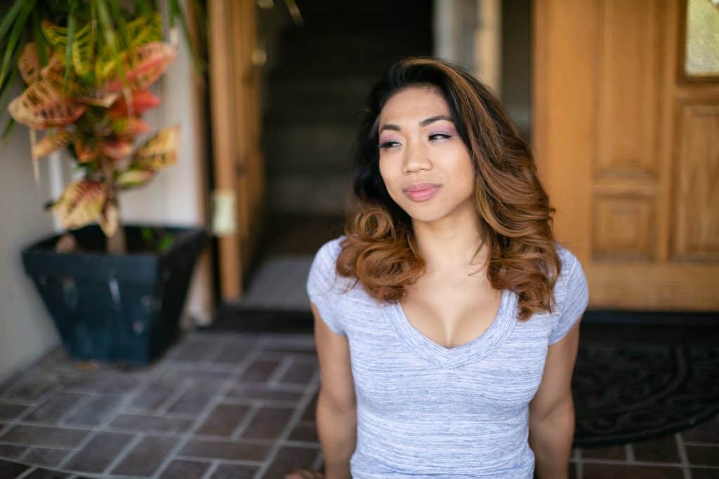 A woman wearing a gray dri fit shirt