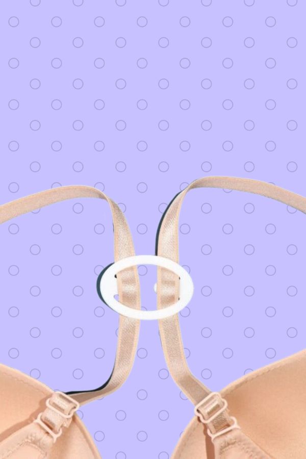White oblong shaped bra clip attached to bra straps