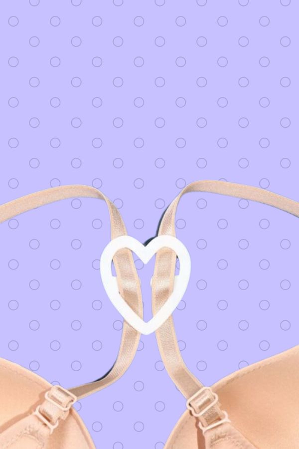 White heart shaped bra clip attached to bra straps