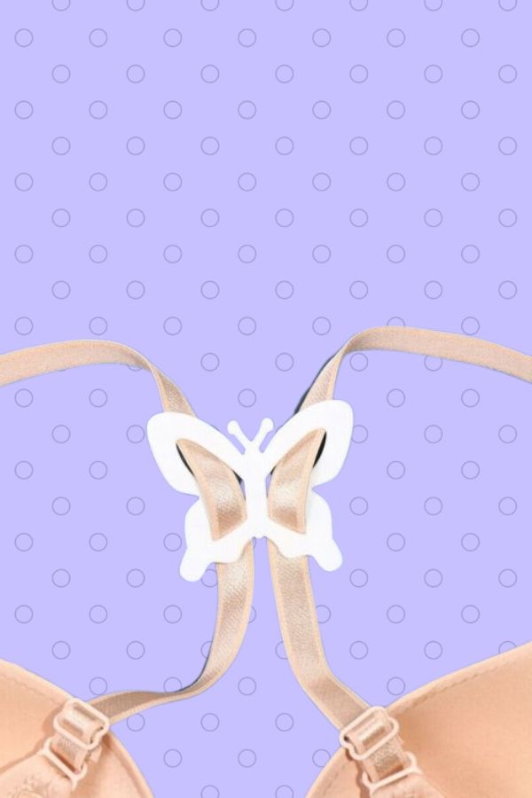 White butterfly shaped bra clip attached to bra straps