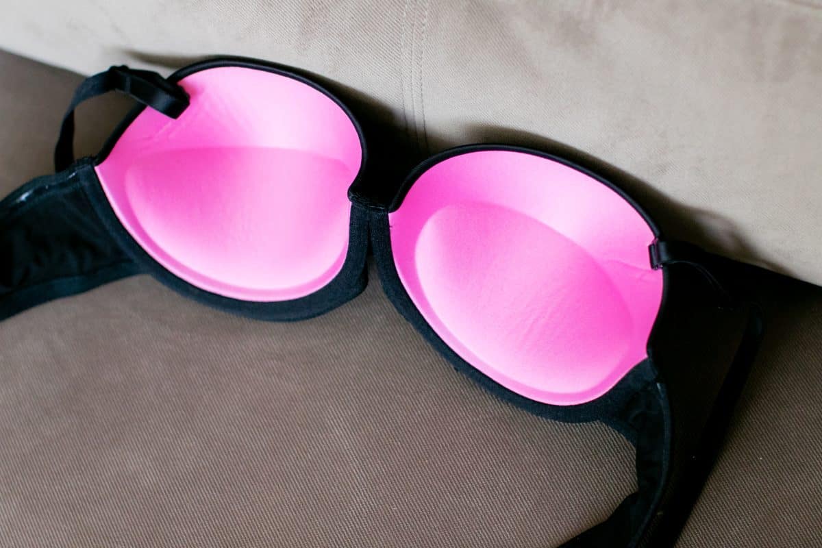 A pink push up bra on a sofa