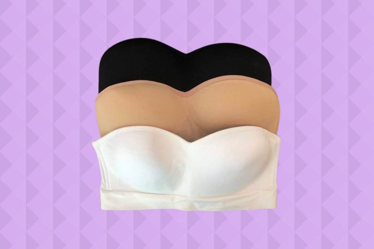 Front view of black, brown, and white strapless bra placed on a purple background
