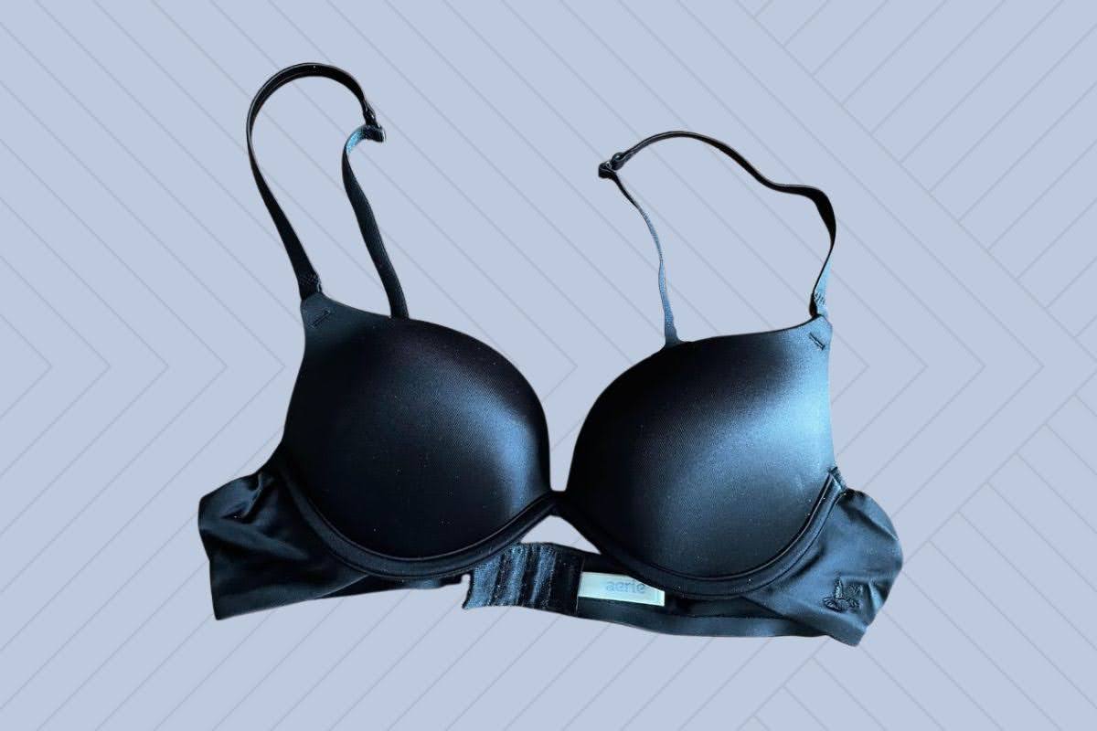 Aerie black underwire push-up bra with adjustable straps placed on a purple background