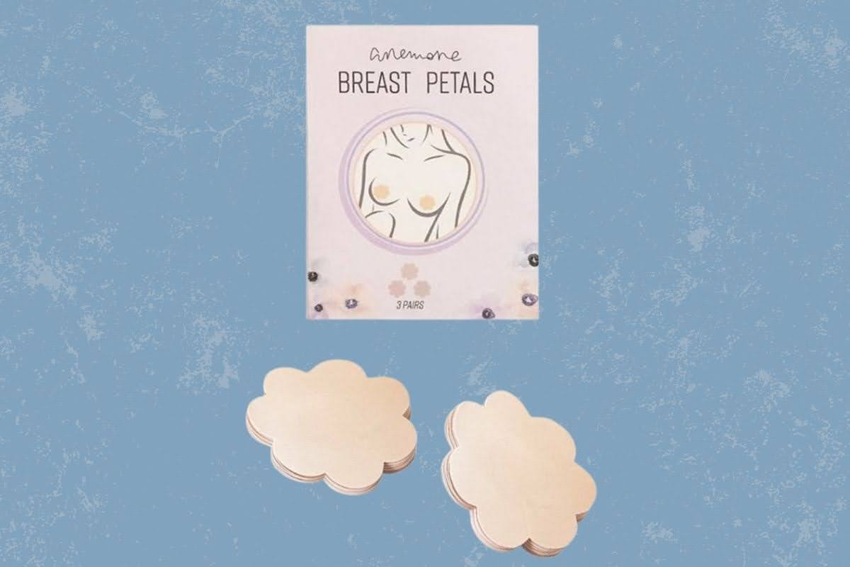 Anemone breast petals are white in color placed on a blue background