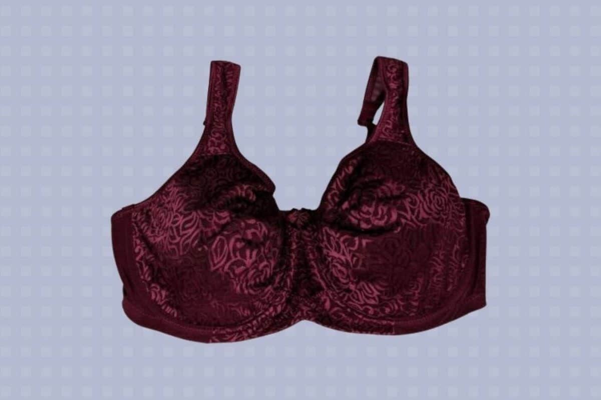 Maroon full coverage underwired bra with a floral design and wide straps placed on a blue background
