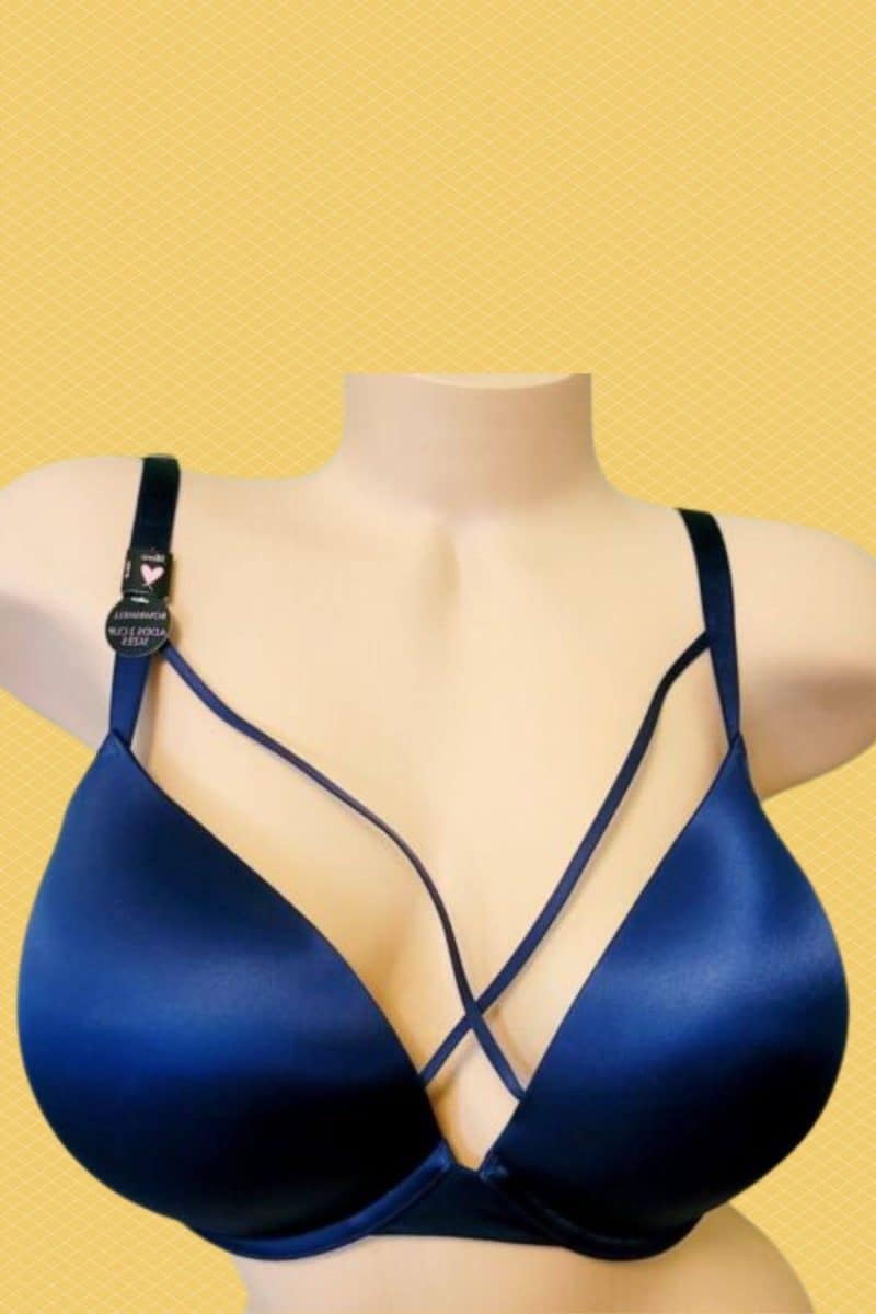 A blue full-coverage underwire bra with an adjustable strap placed on a white mannequin