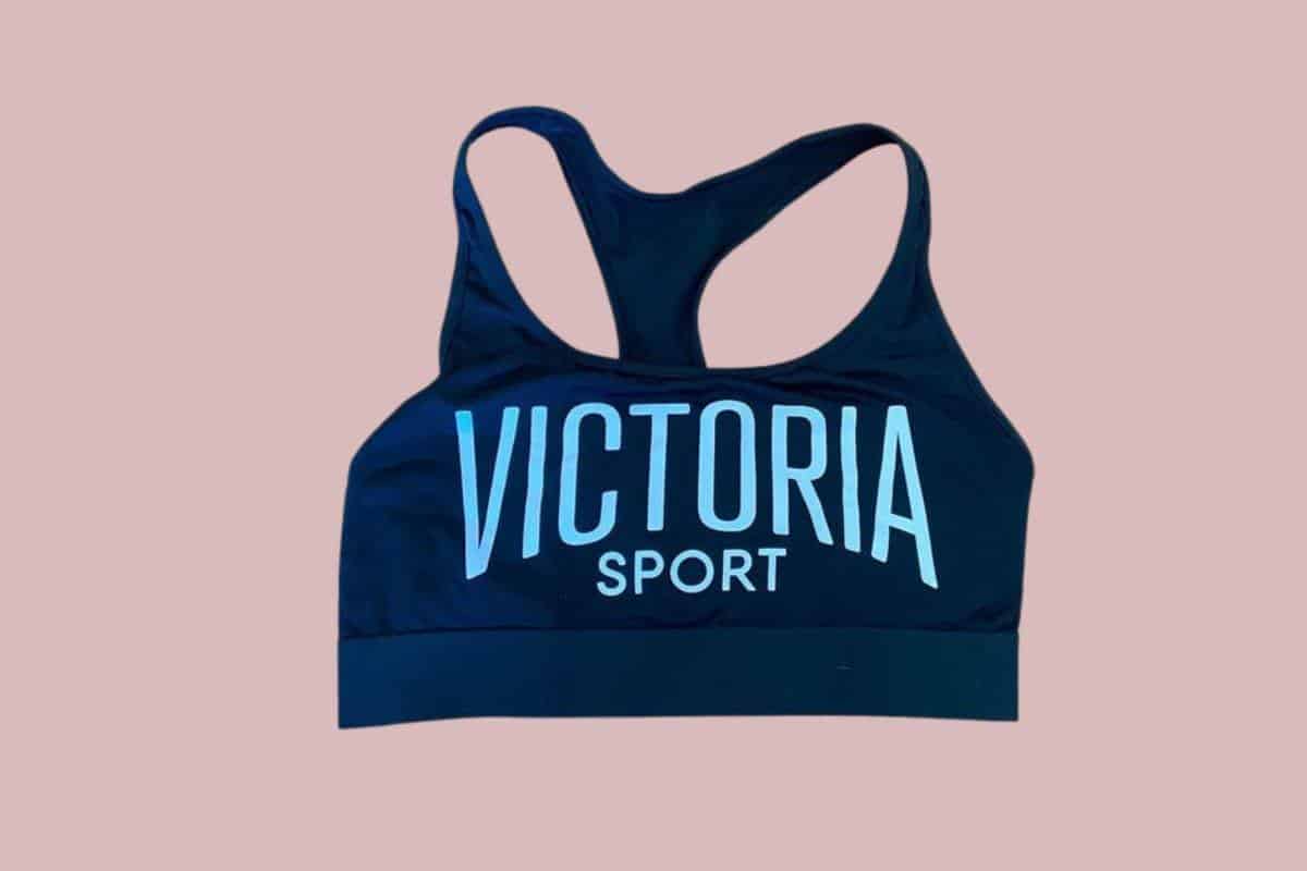 A blue Victoria's Secret racerback sports bra with Victoria Sport printed in front