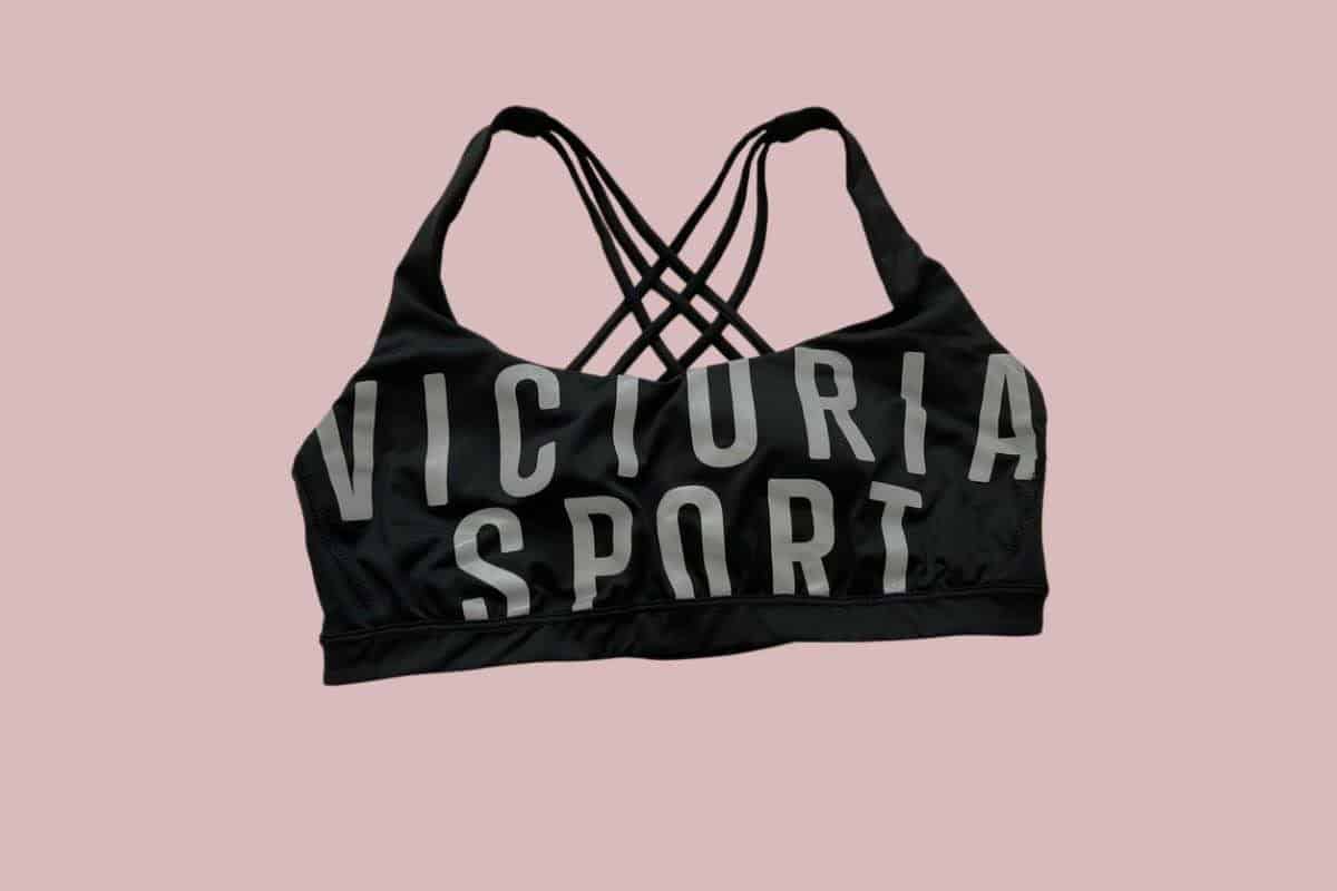 A black Victoria's Secret racerback sports bra with a Victoria Sport printed in front