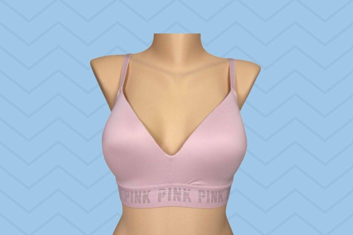 Light pink regular bra with broad bands placed on a brown mannequin