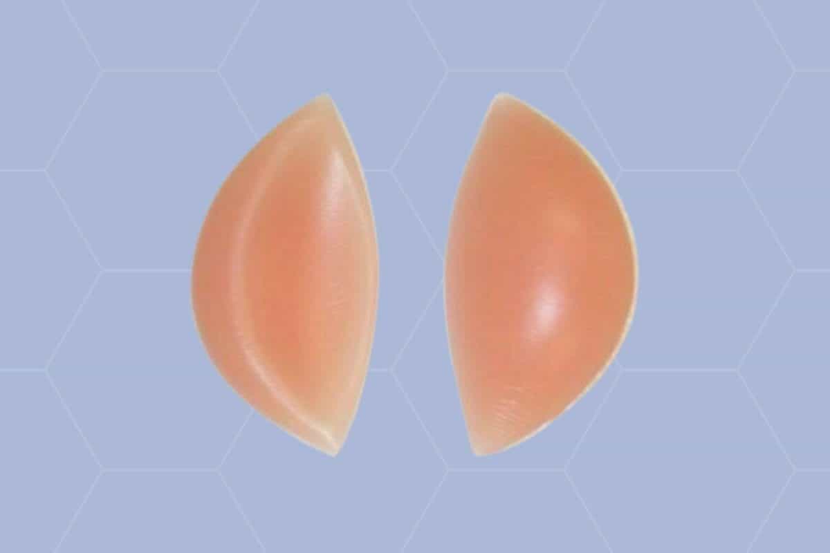 A pair of brown chicken cutlets bra on a blue background