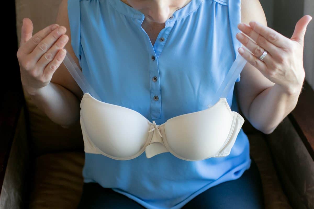 A woman showing a white push up bra