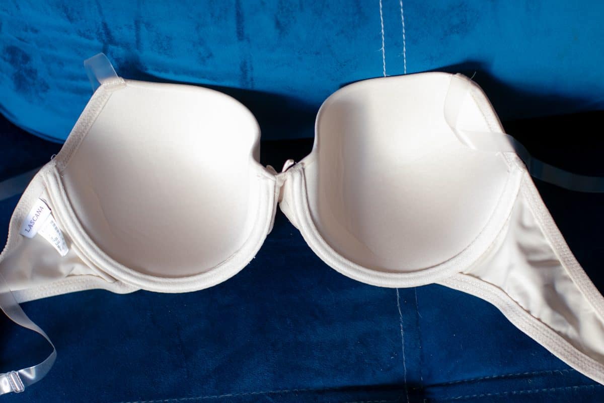 A white push up bra with a blue background