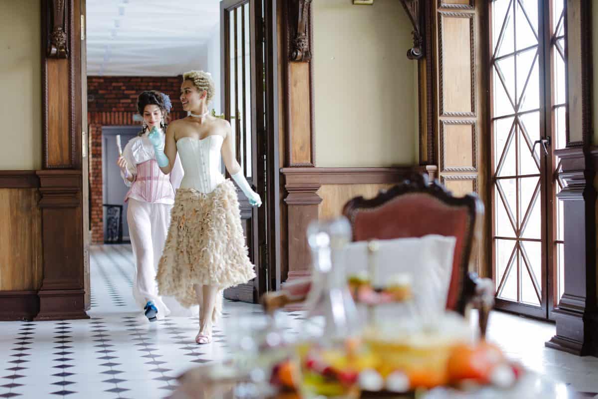 Two woman wearing elegant dresses