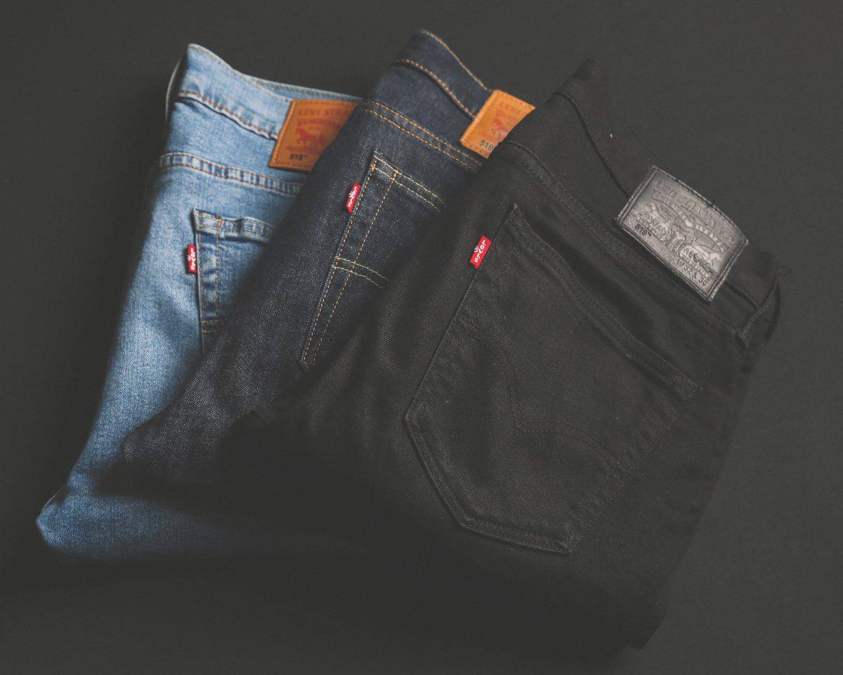 Three different colors of jeans black, blue and light blue