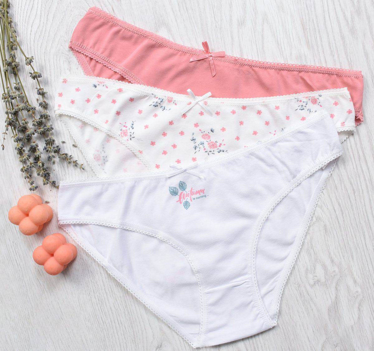 An image of three different cotton panties colored white, white with flowers and pink