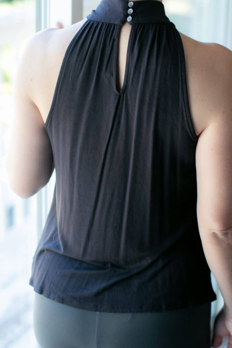 A woman facing backwards wearing a snooth clothing