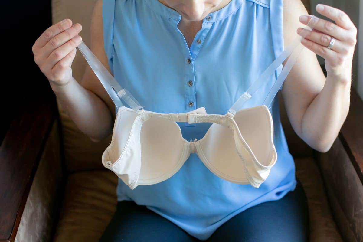 A white push up bra displaying by a woman